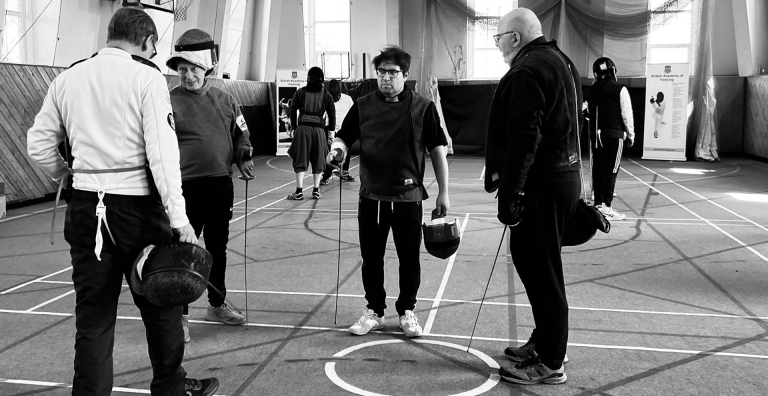 A group of trainee coaches receiving instruction