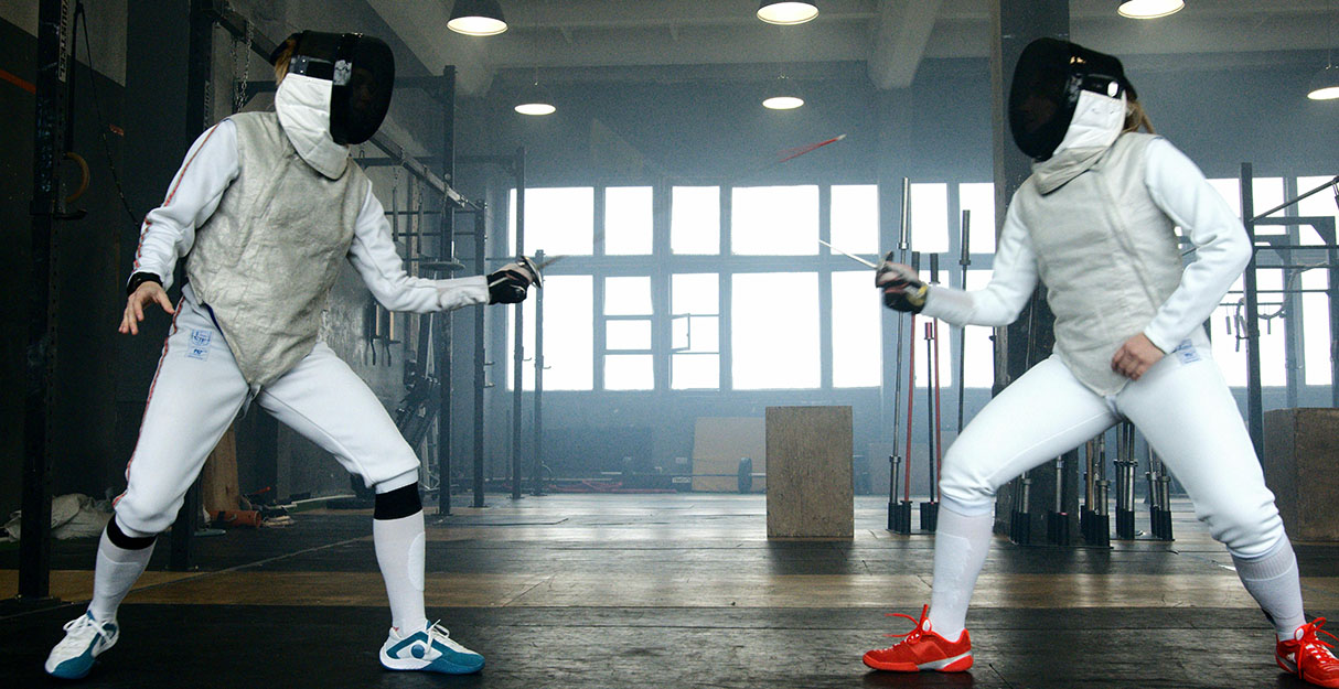 Two fencers having a bout